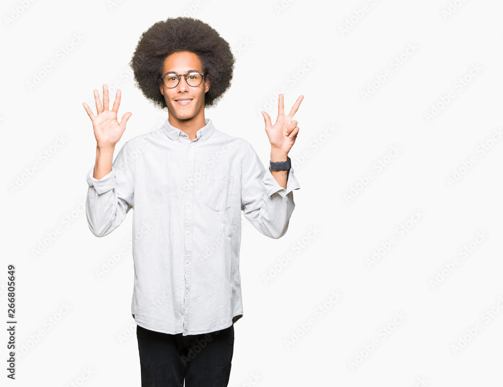 Young african american man with afro hair wearing glasses showing and pointing up with fingers number eight while smiling confident and happy. Young african american man with afro hair wearing glasses showing and pointing up with fingers number eight while smiling confident and happy.