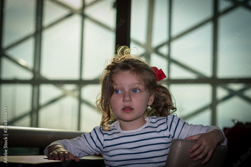 little girl sitting on a high chair little girl sitting on a high chair