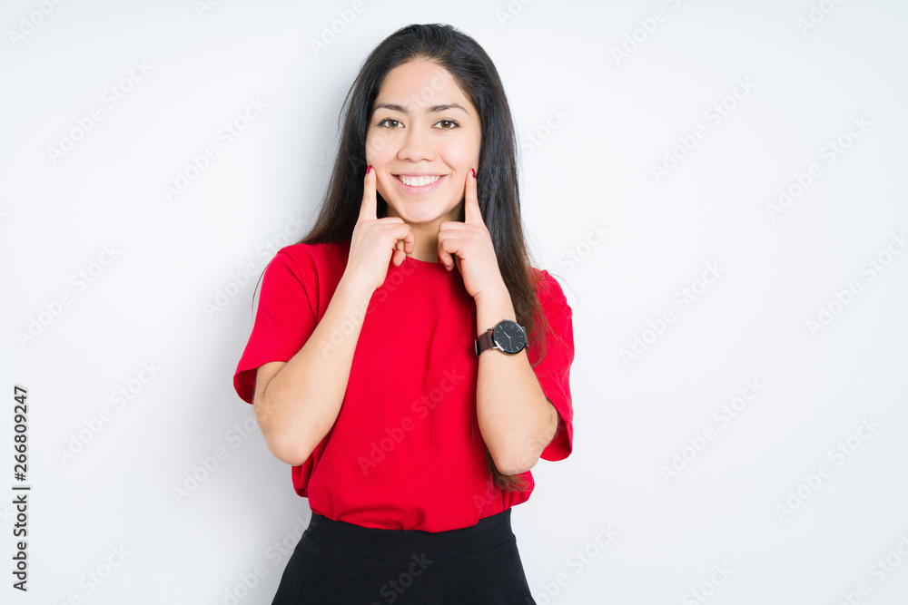 Beautiful brunette woman wearing red t-shirt over isolated background Smiling with open mouth, fingers pointing and forcing cheerful smile Beautiful brunette woman wearing red t-shirt over isolated background Smiling with open mouth, fingers pointing and forcing cheerful smile