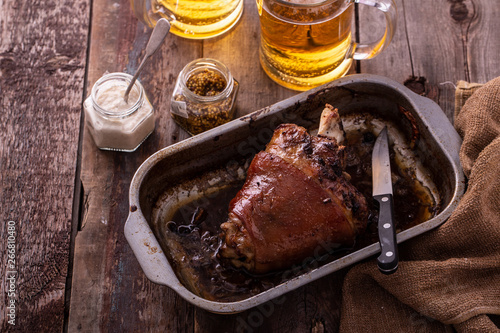 Canvas Print Honey glazed pork knuckle with beer. copy space