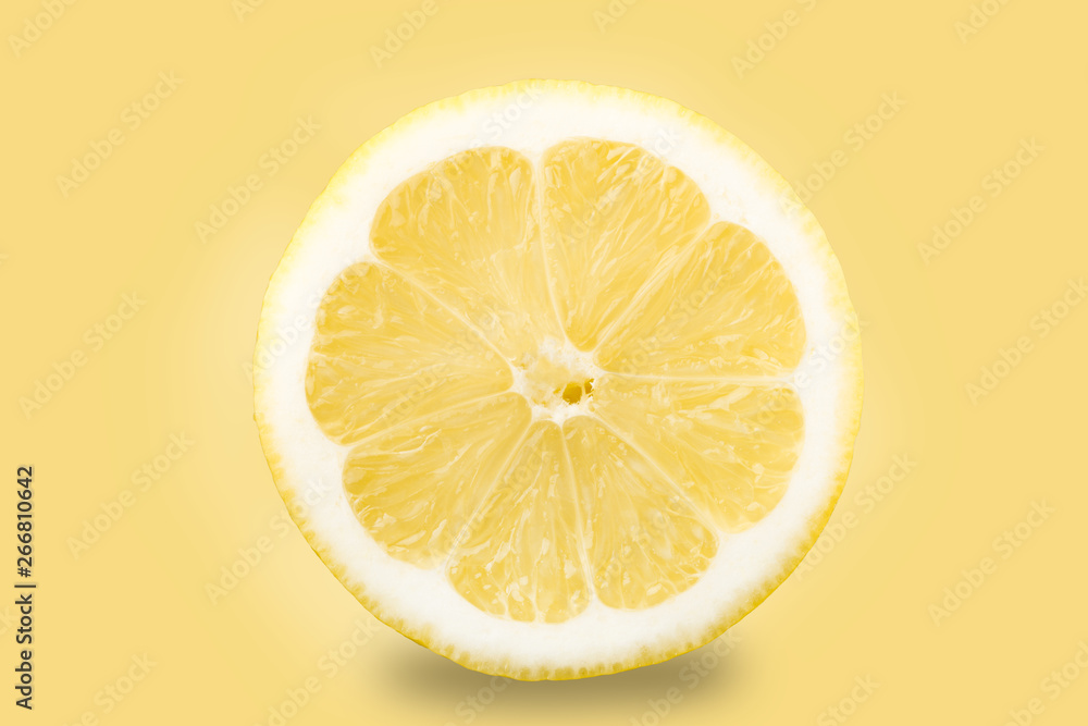 Citrus fruit. lemon A slice of lemon on a yellow background, isolate Citrus fruit. lemon A slice of lemon on a yellow background, isolate