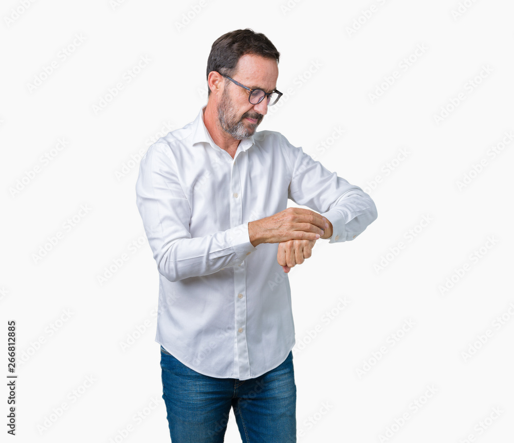Handsome middle age elegant senior business man wearing glasses over isolated background Checking the time on wrist watch, relaxed and confident Handsome middle age elegant senior business man wearing glasses over isolated background Checking the time on wrist watch, relaxed and confident