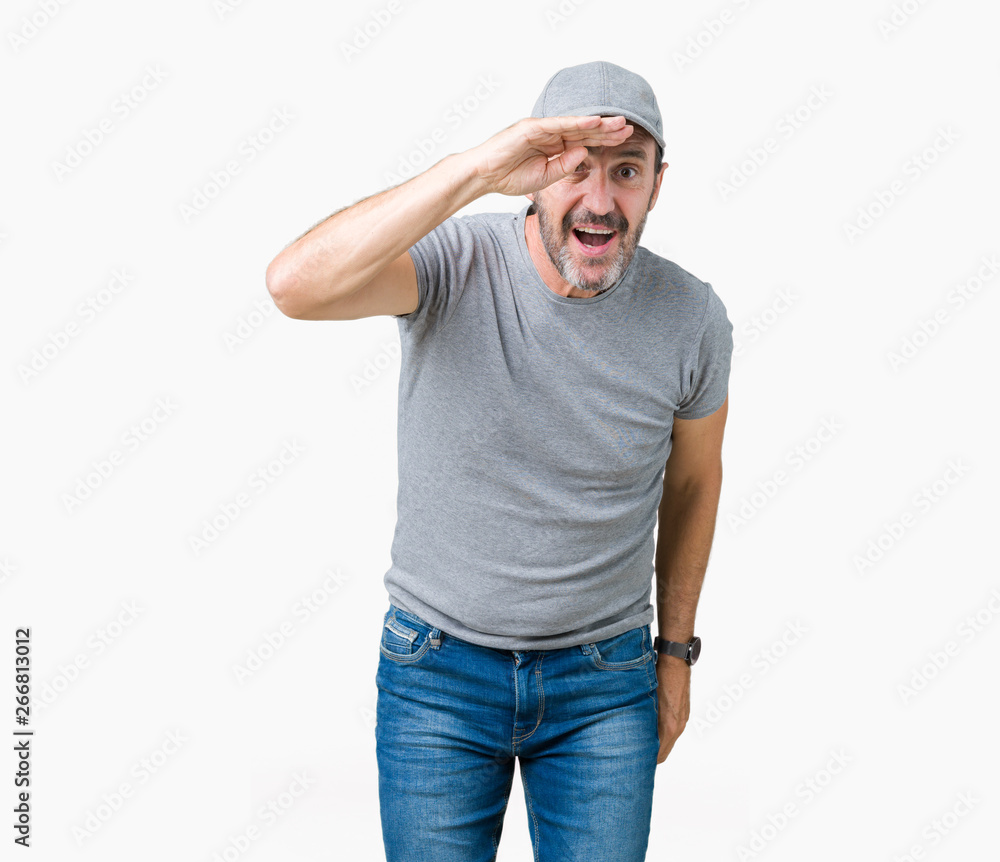 Handsome middle age hoary senior man wearing sport cap over isolated background very happy and smiling looking far away with hand over head. Searching concept. Handsome middle age hoary senior man wearing sport cap over isolated background very happy and smiling looking far away with hand over head. Searching concept.