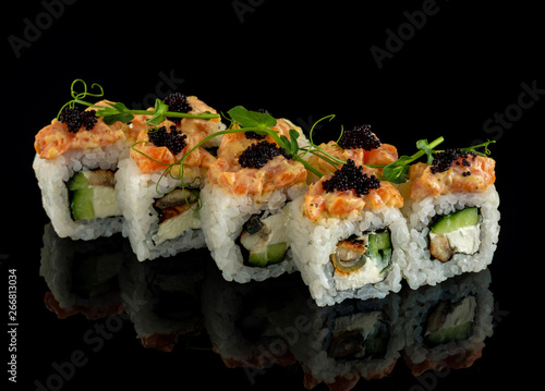 Set sushi roll. Traditional Japanese cuisine. Isolated on black background