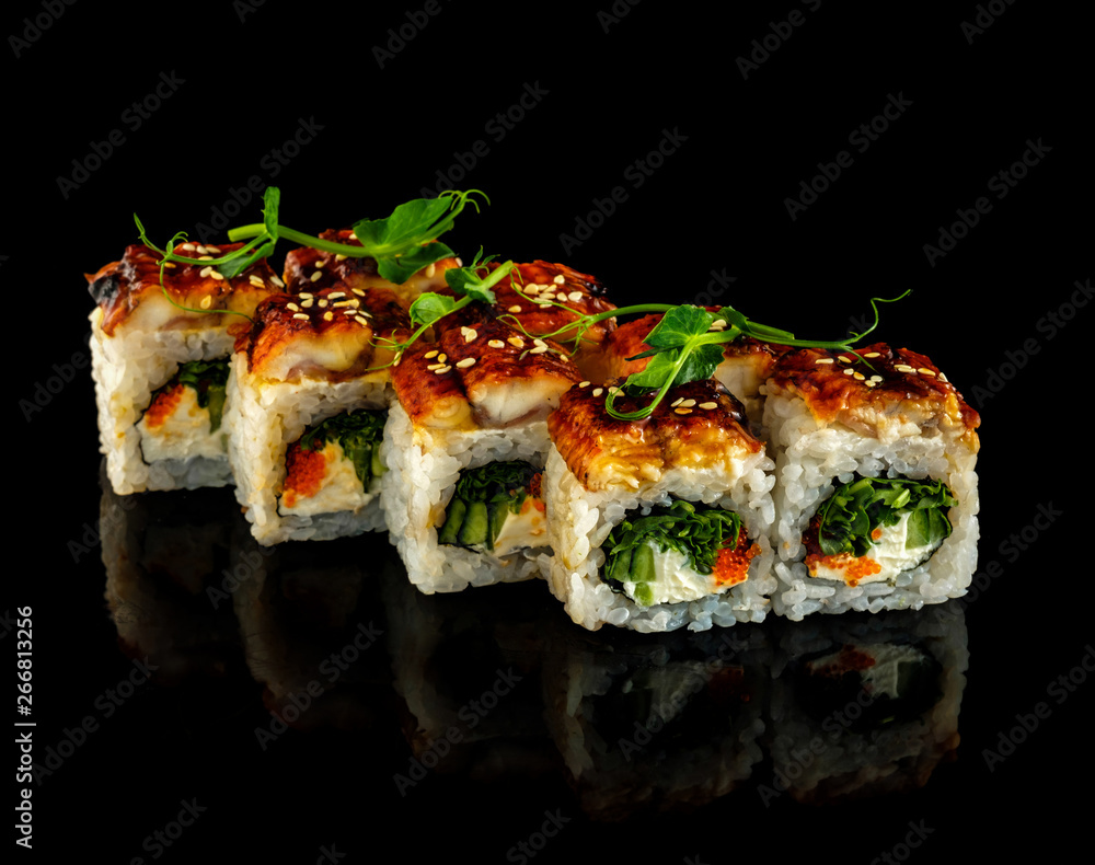 Set sushi roll. Traditional Japanese cuisine. Isolated on black background