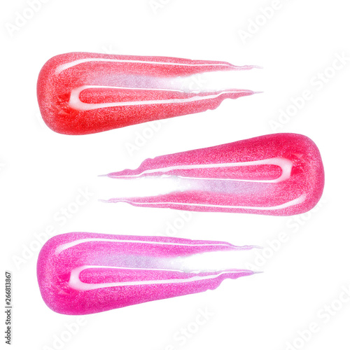 Set of different colors lip glosses smear isolated on white. Smudged makeup product sample