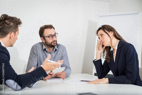 Фотография Businesswoman disagree with her colleagues on a meeting.