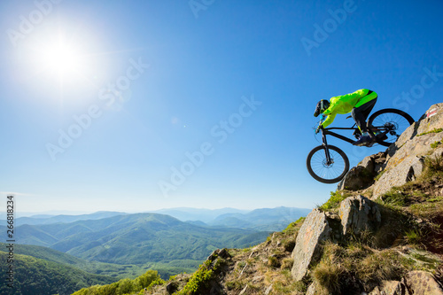 Man on mountain bike rides on a beautiful rocky trail