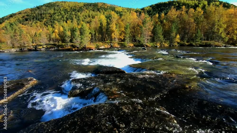 Wild river flowing among green woodland hills on a autumn day Wild river flowing among green woodland hills on a autumn day