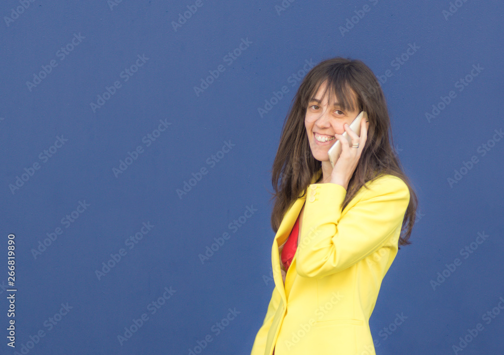 Girl with mobile looking at camera Girl with mobile looking at camera