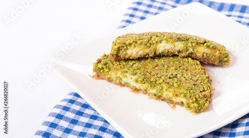 turkish kunefeh portion with pistachio photo