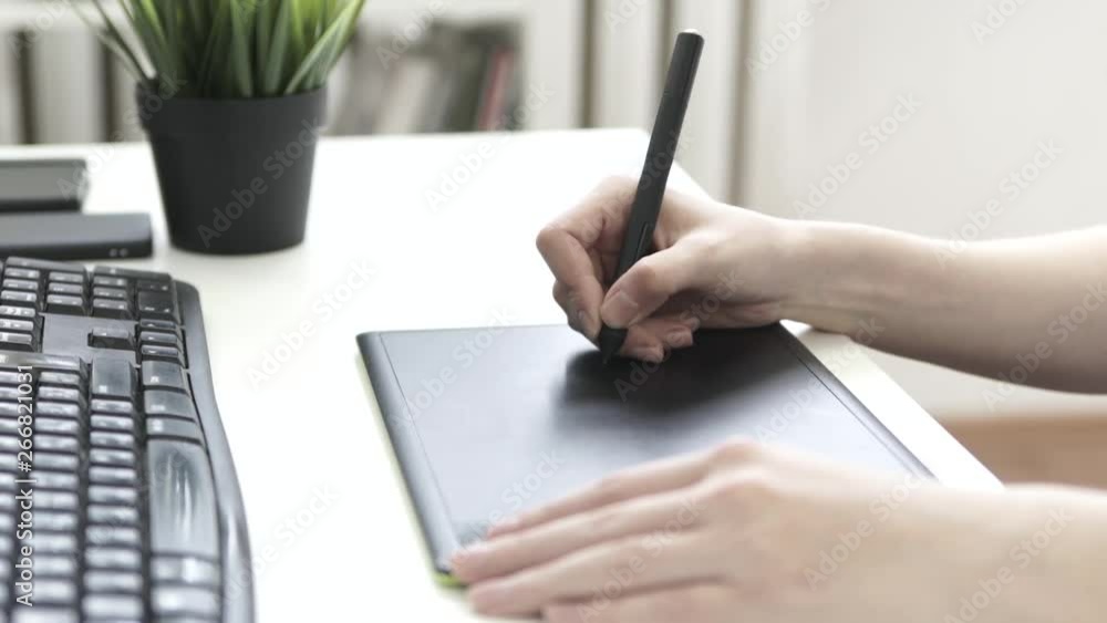 Graphic designer using drawing tablet Graphic designer using drawing tablet