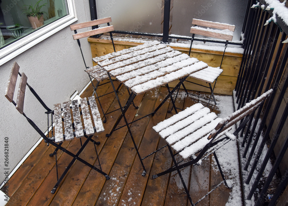 Patio set on deck covered in snow Patio set on deck covered in snow