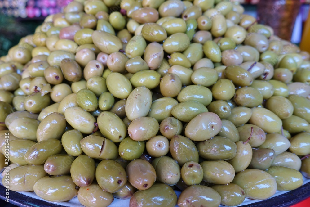 Bowl of colorful marinated olives piled up high at a Marrakesh market Bowl of colorful marinated olives piled up high at a Marrakesh market