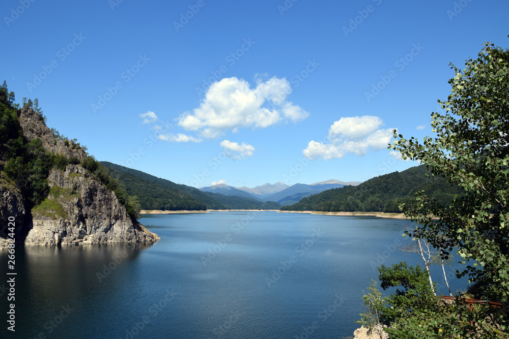 Landscape of Lake Vidraru (Lacul Vidraru). View from Vidraru dam in Fagaras Mountains. Transfagarasan road, Romania.