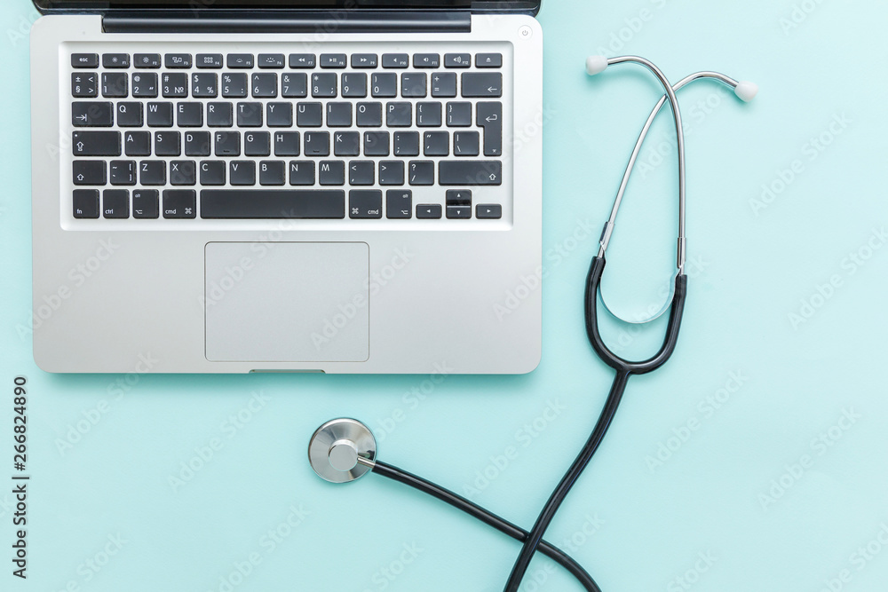 Stethoscope keyboard laptop computer isolated on blue background. Modern medical Information technology and sofware advances concept. Computer and gadget diagnostics and repair. Flat lay top view Stethoscope keyboard laptop computer isolated on blue background. Modern medical Information technology and sofware advances concept. Computer and gadget diagnostics and repair. Flat lay top view
