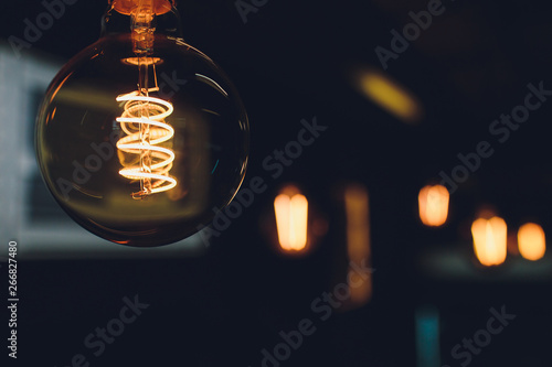 Fényképezés Retro light bulbs hanging in department store, with decorate interior luxury, fixtures combine beautiful modernity Designer, lamps on the ceiling, beautifully laid out