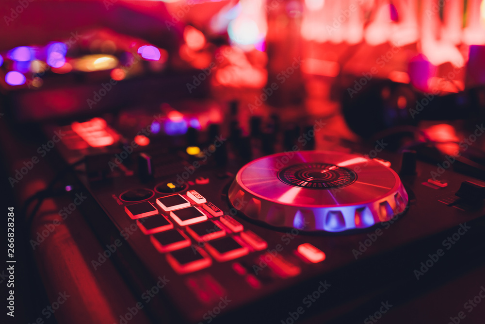 DJ turntable console mixer controlling with two hand in concert