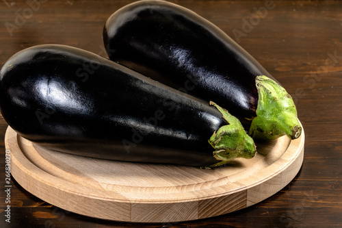 eggplants on wooden background