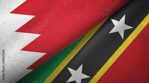 Bahrain and Saint Kitts and Nevis two flags textile cloth, fabric texture photo