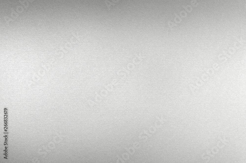 Glowing brushed silver steel wall, abstract texture background