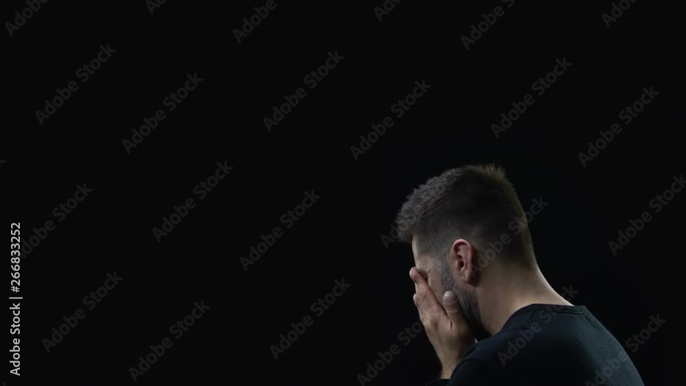 Son of God supporting crying desperate man on dark background, spiritual help Son of God supporting crying desperate man on dark background, spiritual help