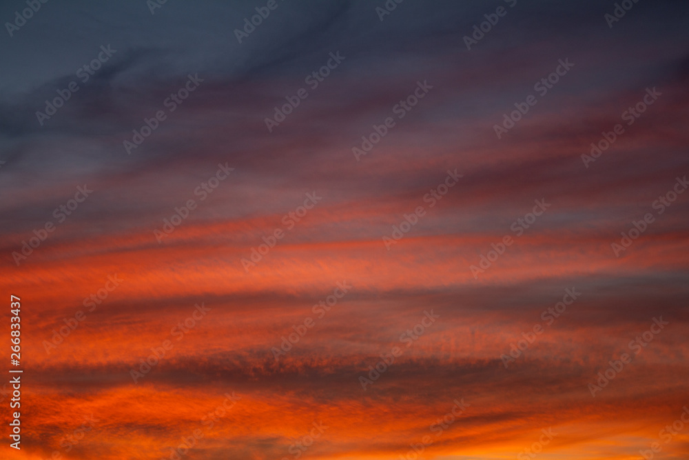 Colorful clouds during sunset in full golden hour.