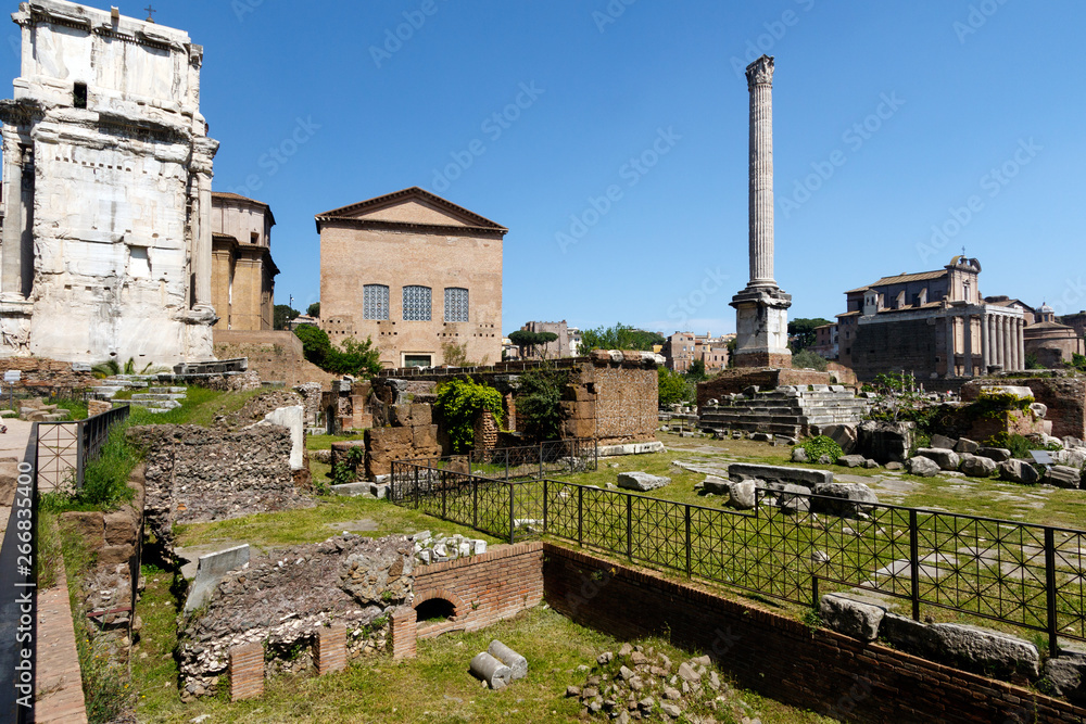 Imperiral Roman Forum in Rome, Italy with a blue sky background