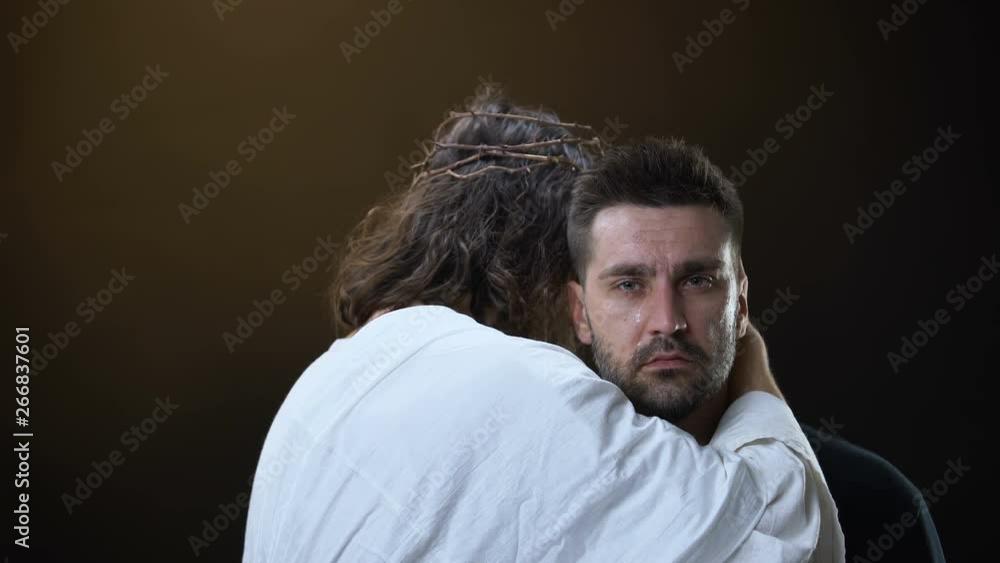 Messiah in white cloth hugging crying desperate male, religious support, faith Messiah in white cloth hugging crying desperate male, religious support, faith
