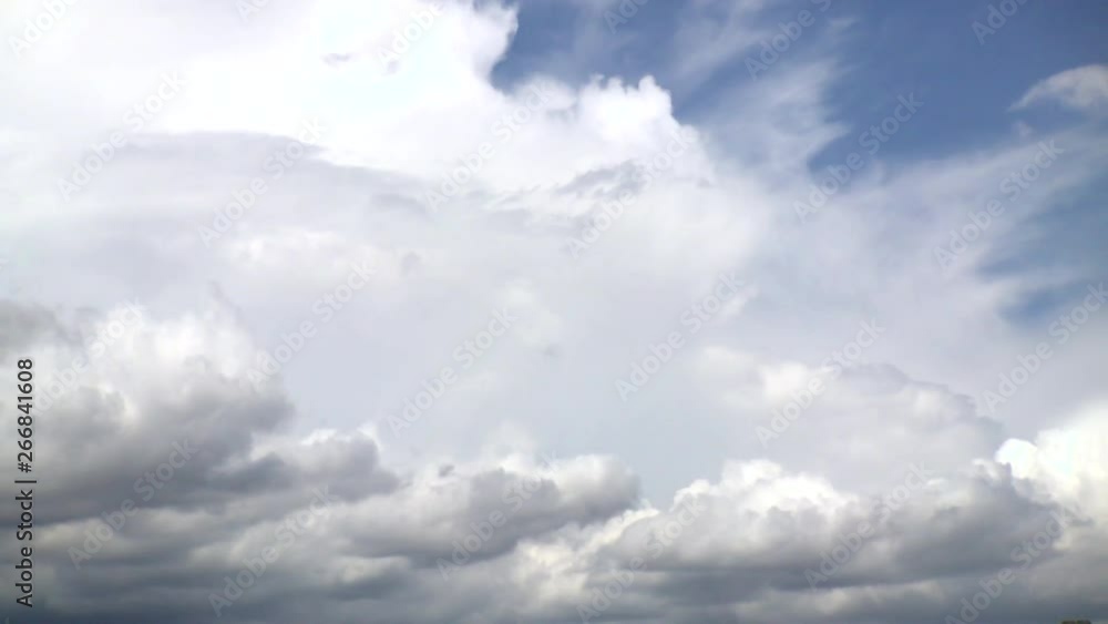 In a time-lapse view, white clouds in the sky are shown quickly moving and forming, followed by dark storm clouds rolling in. In a time-lapse view, white clouds in the sky are shown quickly moving and forming, followed by dark storm clouds rolling in.
