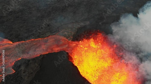 fissure 8 exploding from the air into the air!!  birds eye view capturing epic aerial visuals of molten lava!!! lava river flow away from cone!! photo