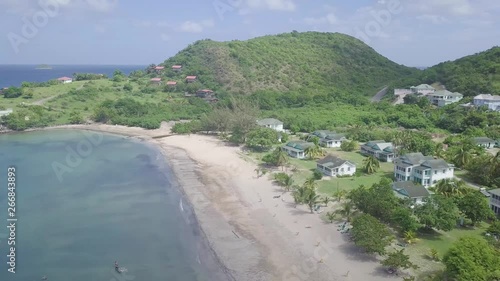 Aerial over the shores and beaches of Nevis, an island in the Caribbean. photo