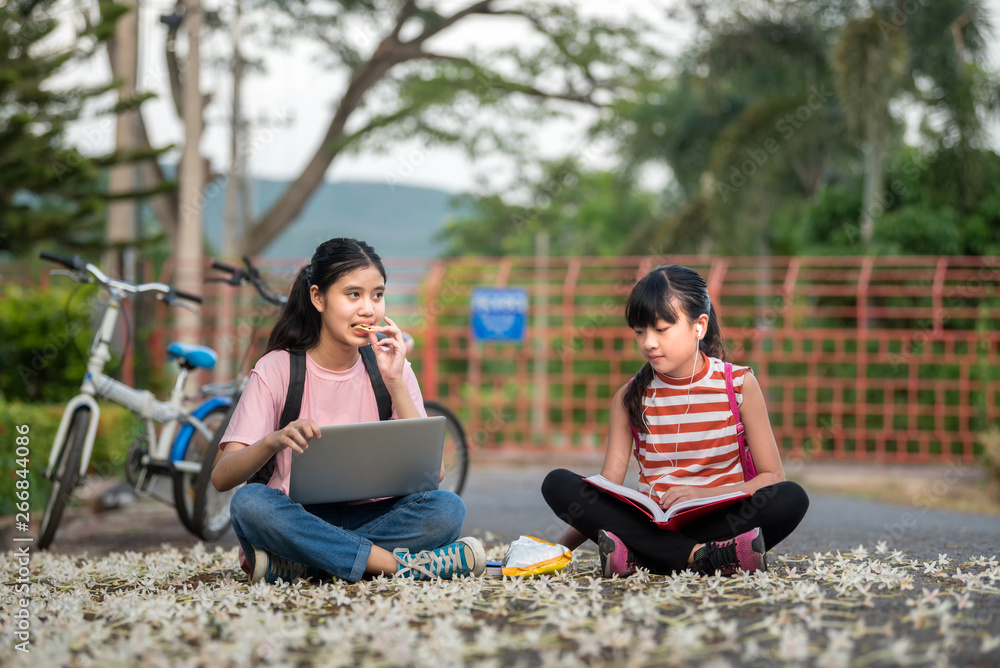 Little two girls prepare back to school after the school long holidays with school bag, primary education level, education concept. Little two girls prepare back to school after the school long holidays with school bag, primary education level, education concept.