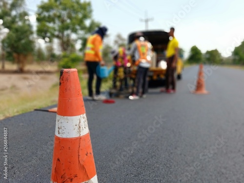Drilling for asphalt road surface to find road thickness, blurred images