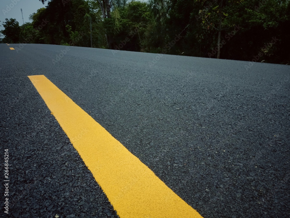 Obraz premium Road traffic paint Yellow on the asphalt surface