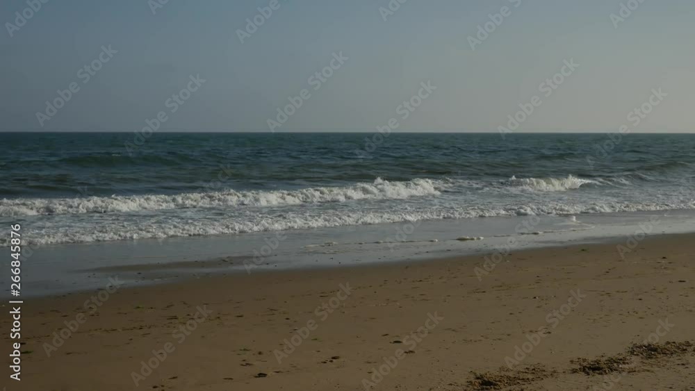 Waves at the shore in the beach Waves at the shore in the beach