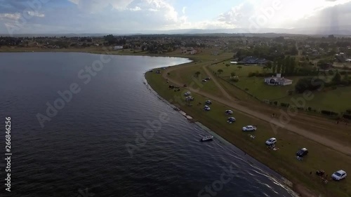 Wallpaper Mural Aerial drone shot of a quadricycle in the lake shore with a big cloud in the background Torontodigital.ca