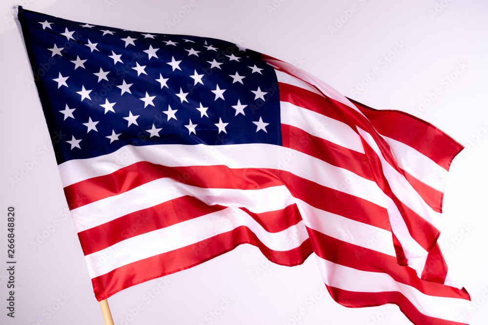 American flag background for Memorial Day or 4th of July with copy space. Or Independence Day background. Beautifully waving star and striped American flag.