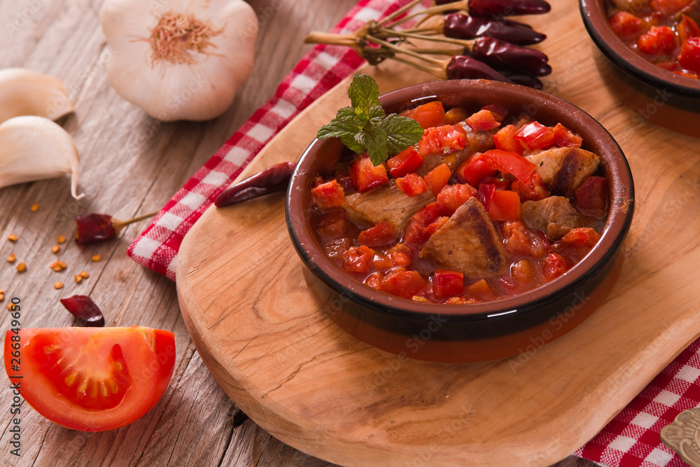 Marinated pork loin in tomato sauce. Marinated pork loin in tomato sauce.