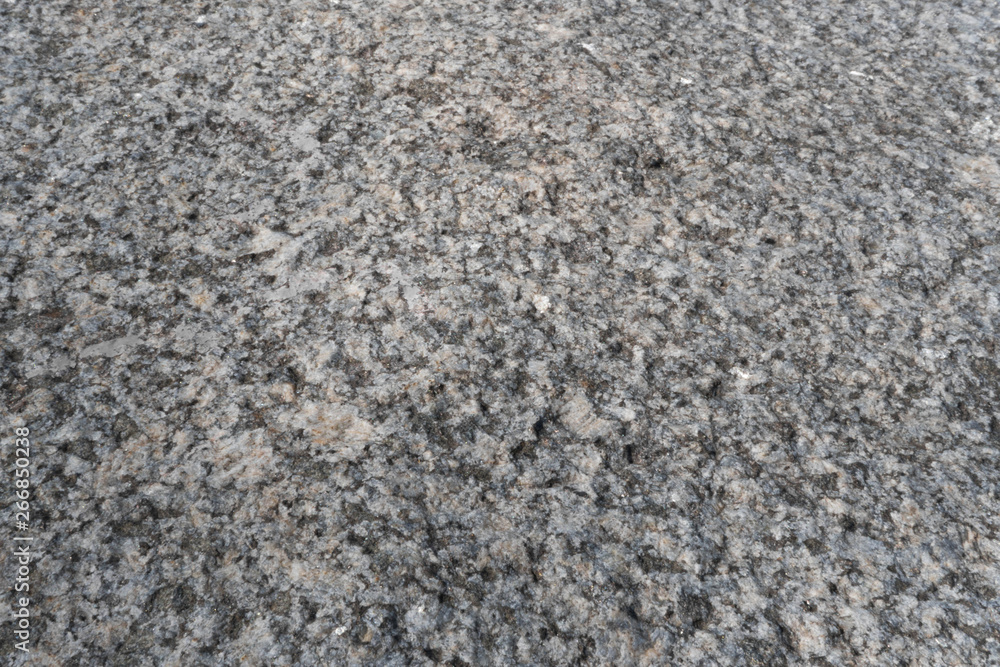 Granite crumb texture. Grey gritty rock surface. Non polished white granite as a background, texture for illustration Granite crumb texture. Grey gritty rock surface. Non polished white granite as a background, texture for illustration