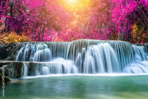 Fototapeta Naklejka Na Ścianę i Meble -  Amazing in nature, beautiful waterfall at colorful autumn forest in fall season
