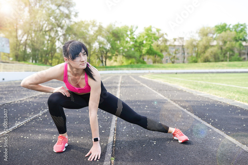 Fitness sporty woman during outdoor exercises workout. copy space. Weight Loss. Healthy lifestyle. Sporty healthy female