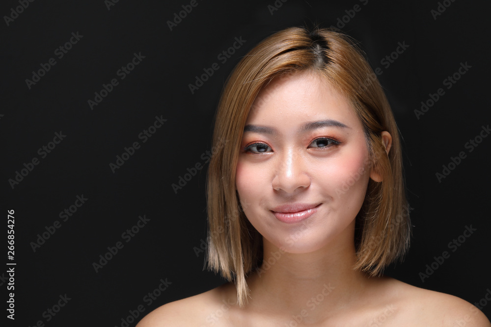 Young beautiful Asian woman makeup dark background Young beautiful Asian woman makeup dark background