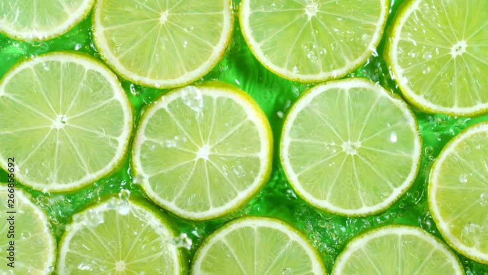 Super Slow Motion Shot of Splashing Water to Lime Slices at 1000fps. Super Slow Motion Shot of Splashing Water to Lime Slices at 1000fps.