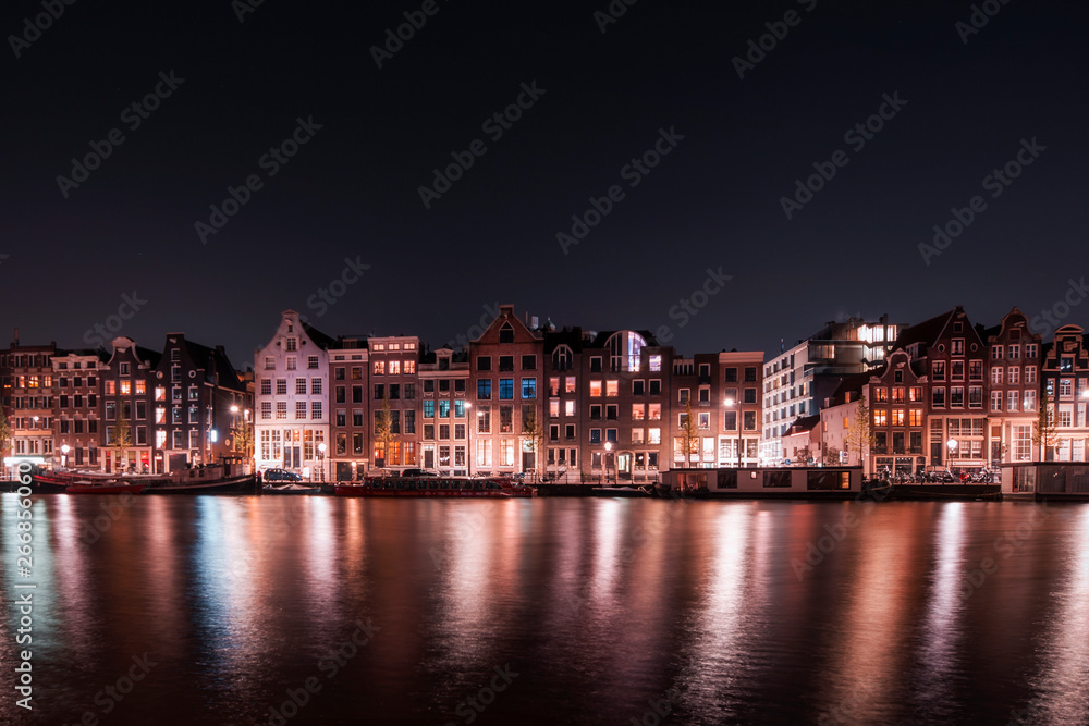 Amsterdam City night river water reflection long expo landscape tourist vacation attraction houses, Holland, Netherlands