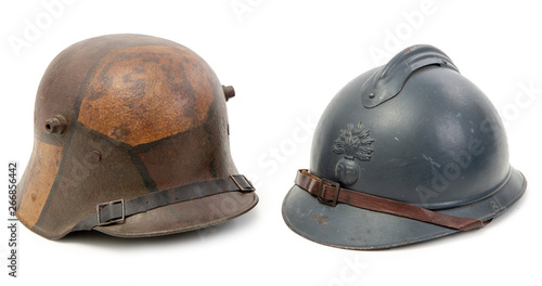 world war one french and german helmets on the white background