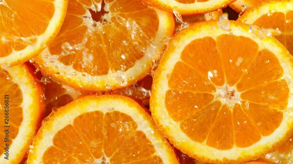 Super Slow Motion Shot of Splashing Water to Orange Slices at 1000fps. Super Slow Motion Shot of Splashing Water to Orange Slices at 1000fps.
