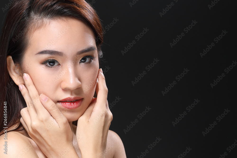 Young beautiful Asian woman makeup dark background Young beautiful Asian woman makeup dark background