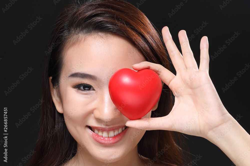 Young beautiful Asian woman makeup dark background Young beautiful Asian woman makeup dark background