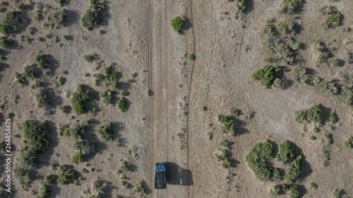 alt overhead view of ATV driving up across Nevada desert photo